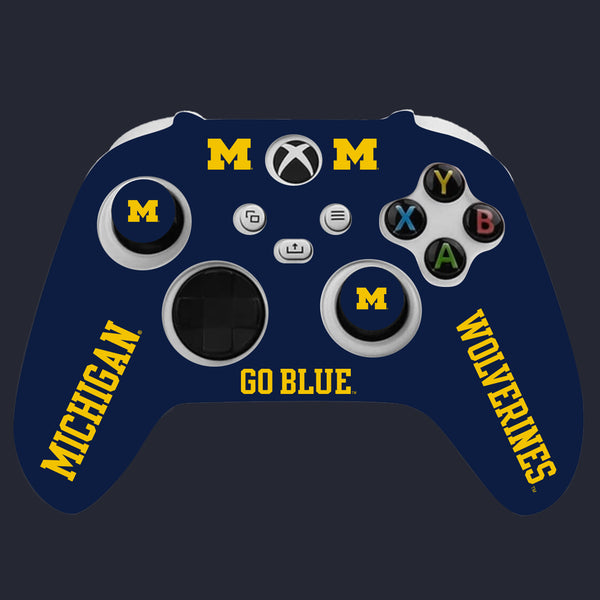 Gaming controller with Michigan Wolverines branding on a dark background