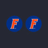Pair of blue silicone Florida Gators Thumb Grips with orange logo for controllers.